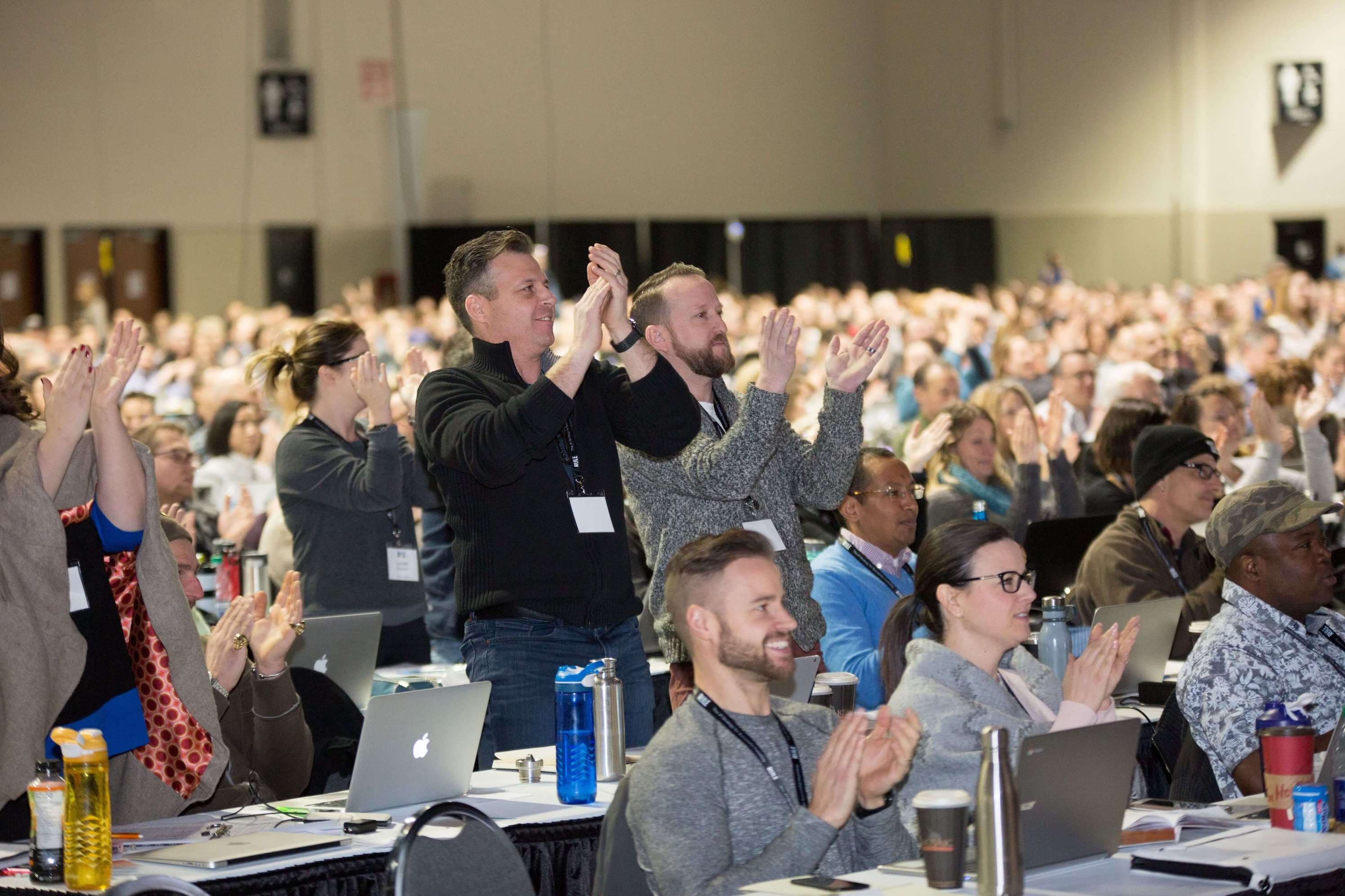 Rule #1 students clapping after investment workshop